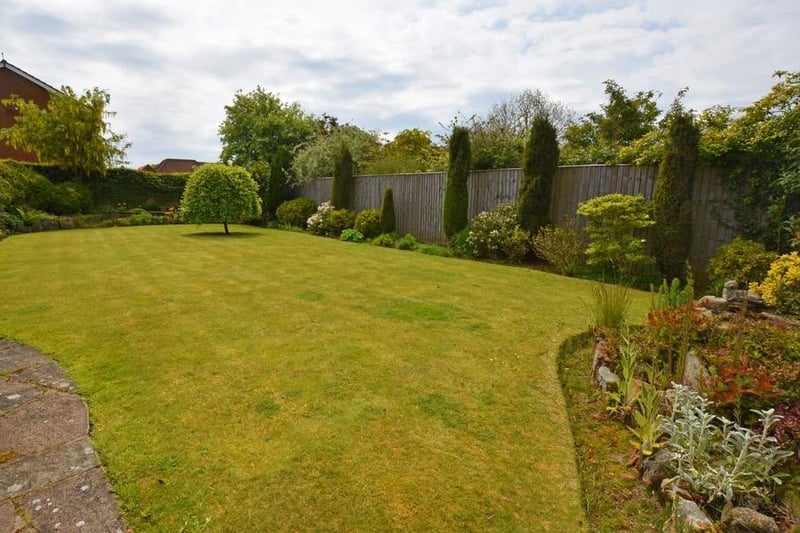 A closer view of the attractive rear garden with the property
