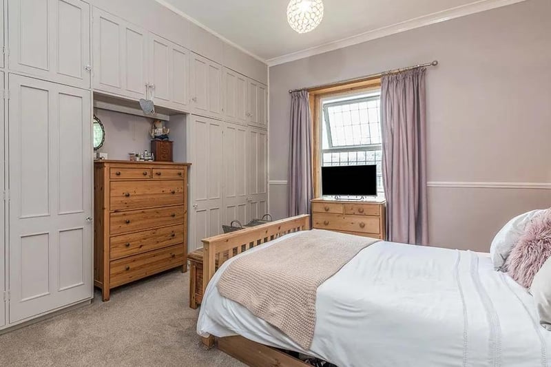 One of the bedrooms with fitted wardrobes and cupboard space