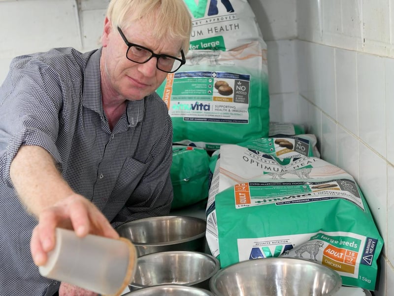 Michael Roebuck, kennel manager, preparing some of the many meals for the Saranbeck St Bernards.