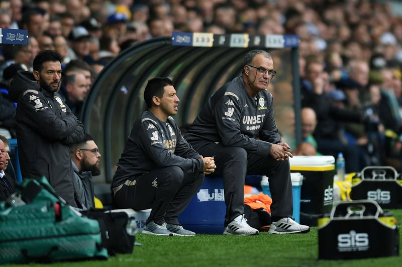 Head coach Marcelo Bielsa watches on with his coaching staff from the dugout.