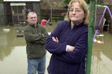 Mr and Mrs Huddlestone in their flooded garden Agbrigg