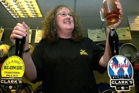 24th October 2003. Julie Robinson admires a pint of Clark's bitter at the Wakefield Beer Festival.