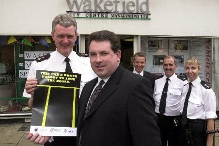 Wakefield City centre manager Nick Holowka with Chief Supt Tim Moorby and police officers detective inspector Ian Whitehouse, PC Paul McMahon and Insp Gillian Ruse launch a new innitiative to crack car crime in the city June 2003.