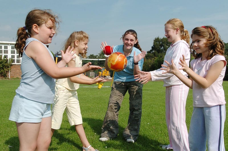 Summer fun at Newby. Pictured, left to right, playing ball are Juliette Scarborough, Adele Swift, Toni Bradley (playworker), Amy Watkin and Annie Reading.