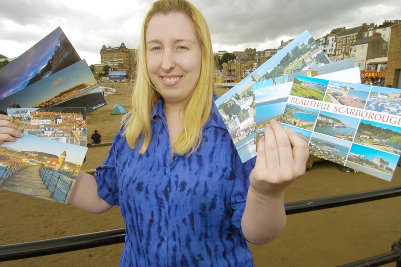 Tourist Information Centre staff member Lynne Ritchie with a selection of Scarborough postcards.