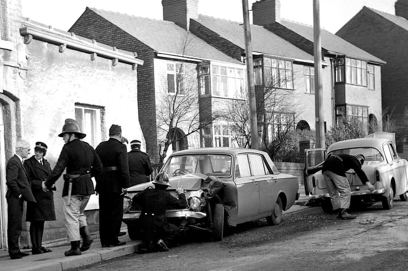RETRO 1970 -  A serious accident in Whelley is attended by fire crew and police.