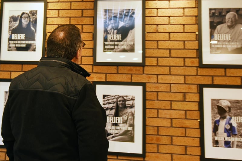 Some of the posters are on display in the reception of DW Stadium.