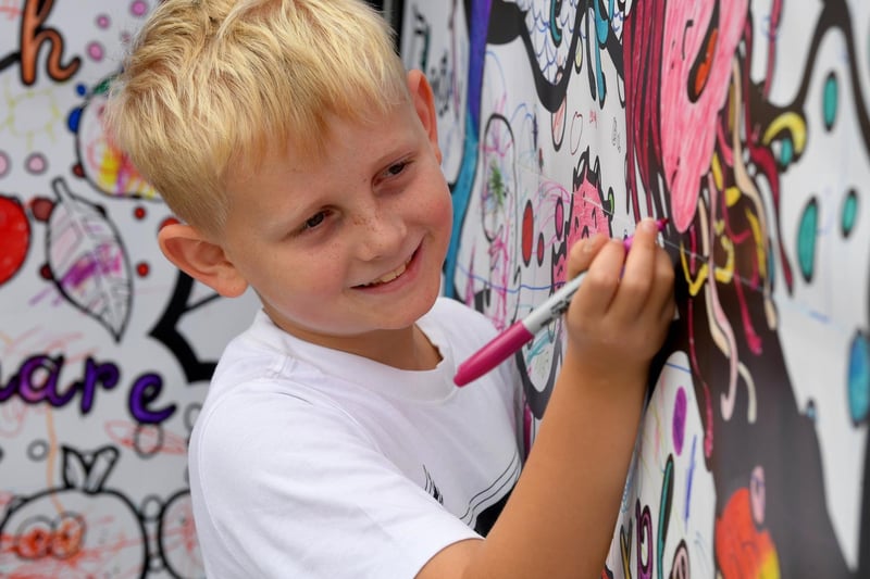 Oliver creates some colour on the art walls