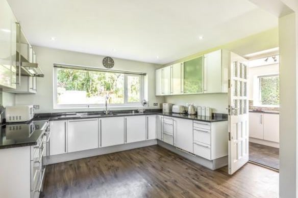 On the first floor is the main living area. The large kitchen is to the front of the property and has white fitted appliances and granite worktops, leaving plenty of room to cook a meal together. There is also an added utility room just off of the kitchen.