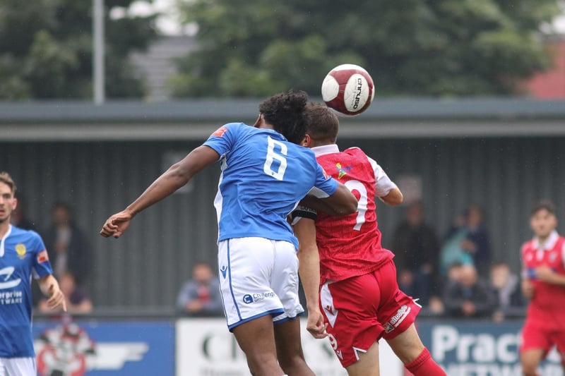 Michael Coulson challenges for a header with Town's Mo Ali

Photo by Morgan Exley