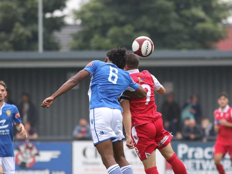 Michael Coulson challenges for a header with Town's Mo Ali

Photo by Morgan Exley