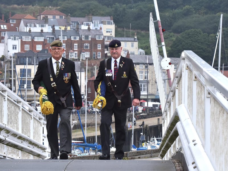 Veterans make their way to the service on Vincent Pier.