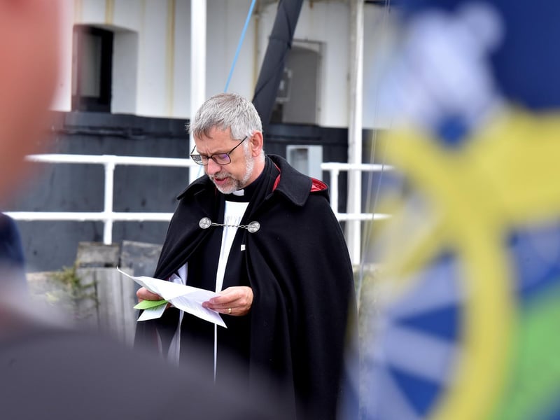 Rev Richard Walker makes a speech during the service.