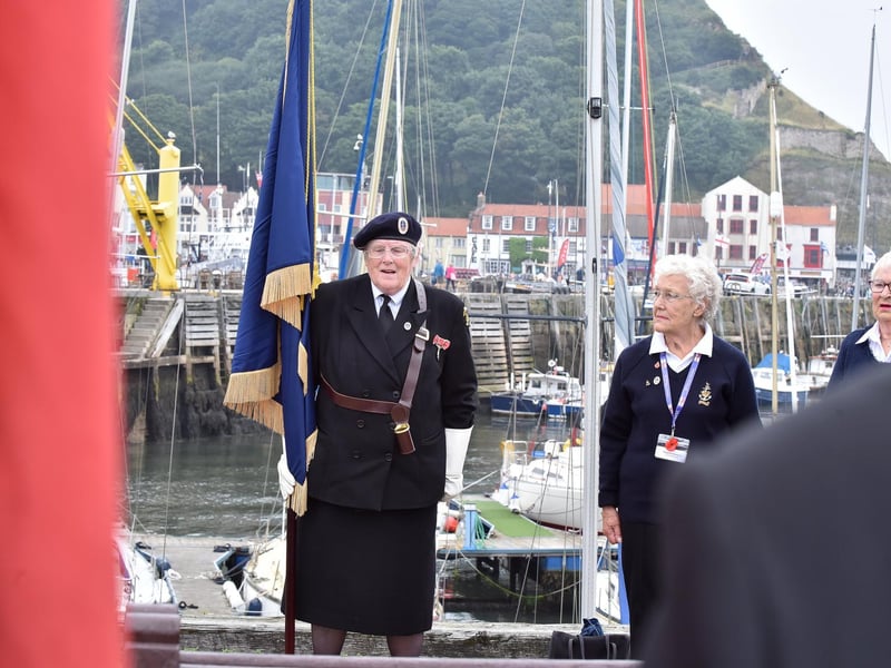 Veterans gather during the service on the pier.