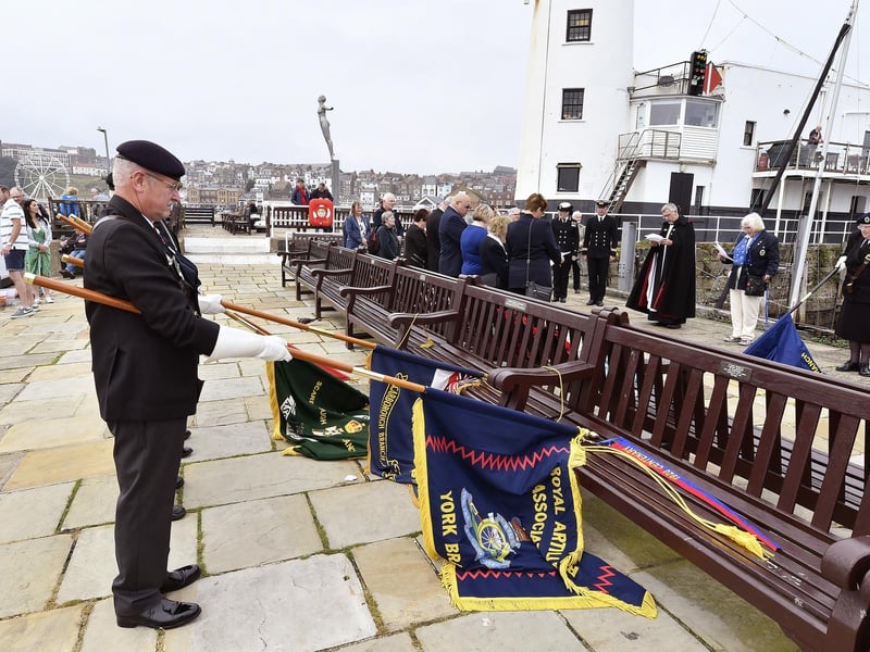 Lowering the standards on the pier in memory of the Scarborough Wrens.