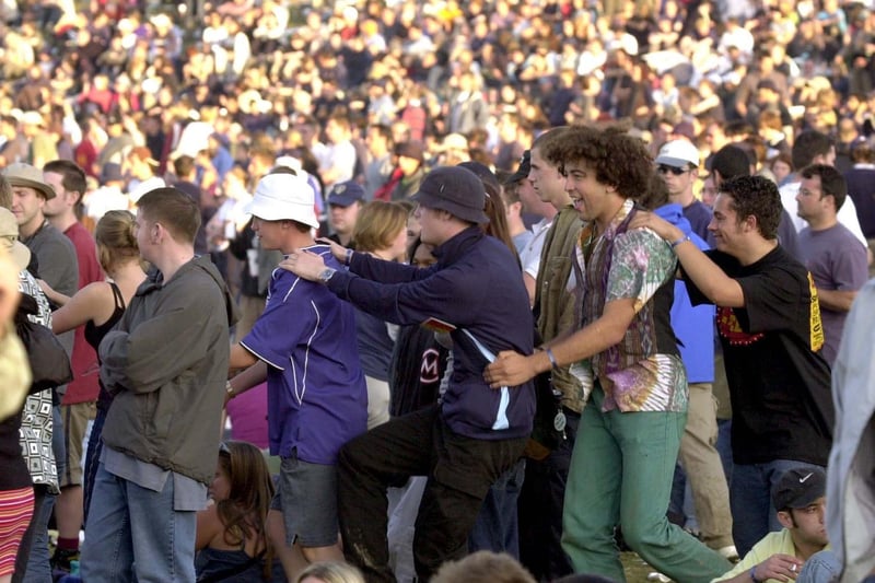 Some of the crowd 'do the conga' during day two in August 2000.