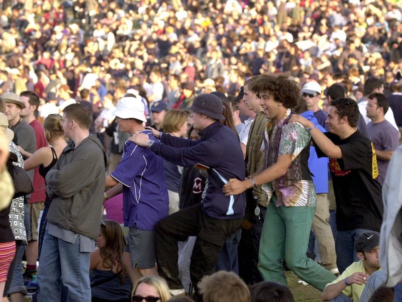 Some of the crowd 'do the conga' during day two in August 2000.