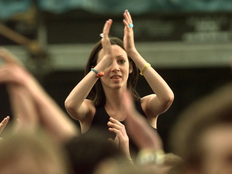 A reveller gets into the festival spirit in August 1999.