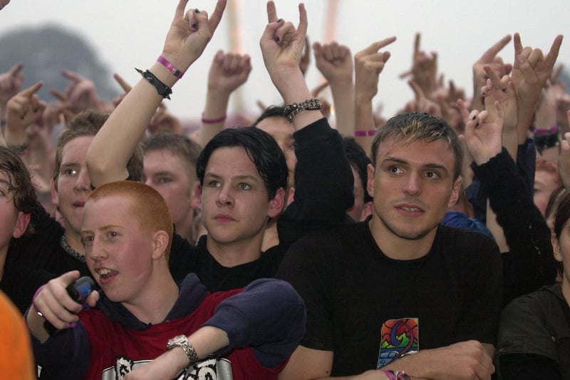 Slipknot fans watch the band on stage.