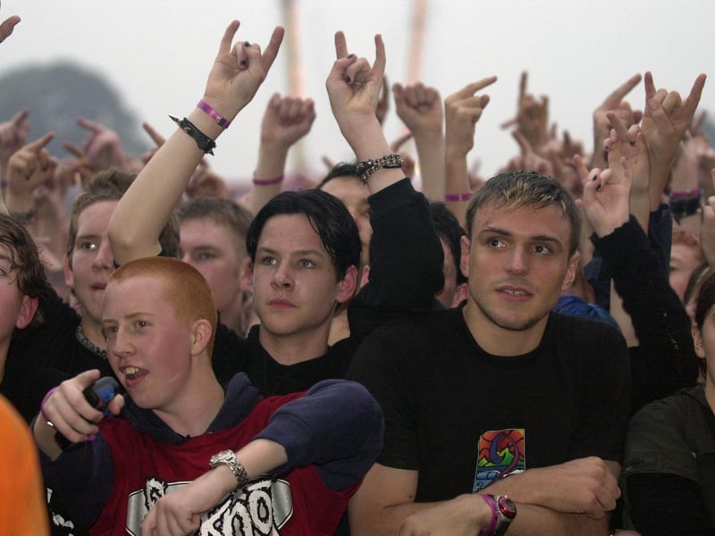 Slipknot fans watch the band on stage.