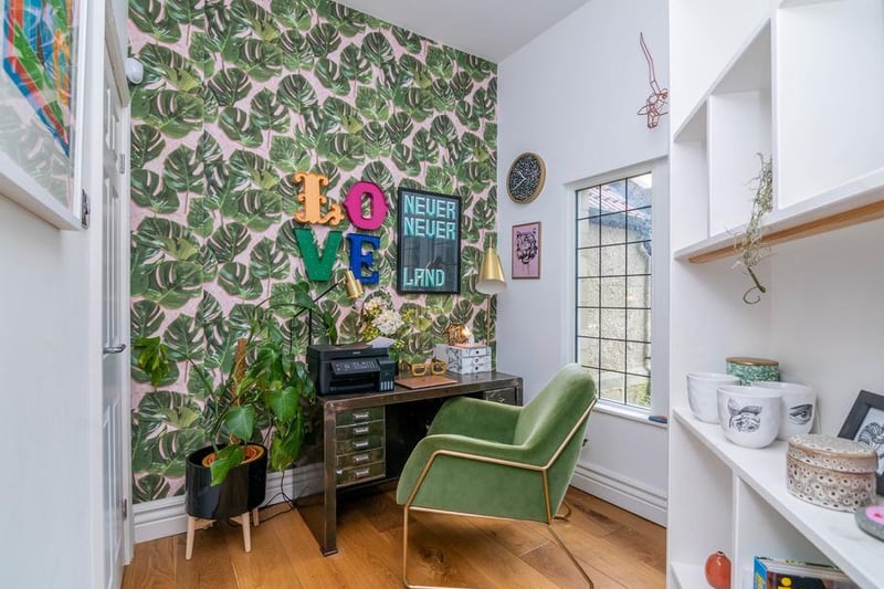 Through the secret bookcase door is a small but perfectly formed office space, complete with the owner's typical flamboyant flair. This is the perfect place to get away from it all.