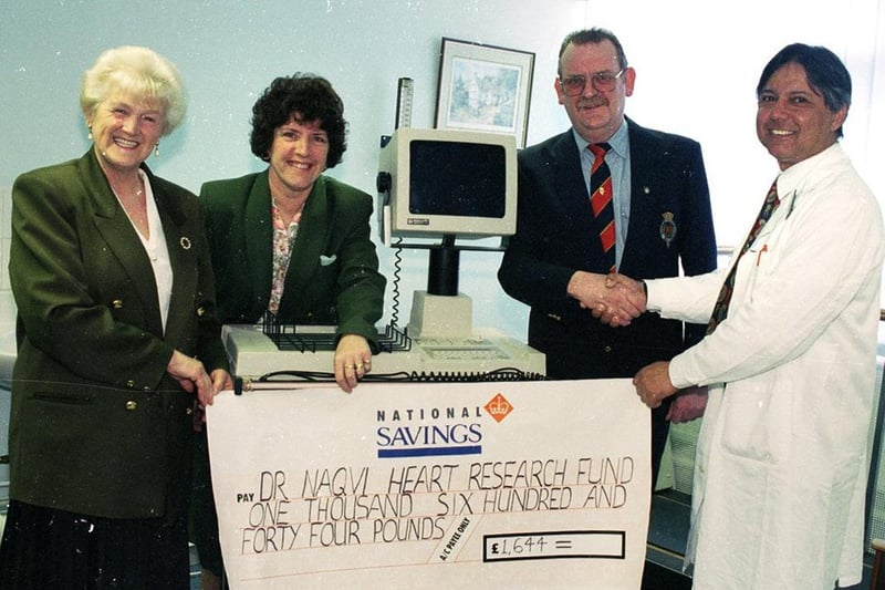 RETRO 1996  - Dr Naqvi receives a giant cheque for £1,644 towards his fundraising.