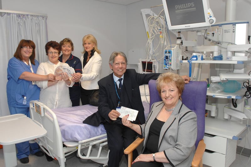 Sheila Baron, front, Karen Jolley and Pauline Ward present Dr Nayyar Naqvi, Staff Nurse Sandra Kassama and Matron Carolyn Dereszkiewicz with £2,500 for the Heartbeat Appeal at the new Coronary Care Unit at Wigan Infirmary, May 2011.