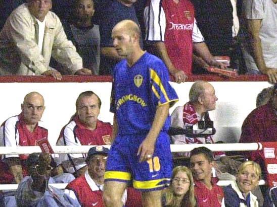 Danny Mills heads for an early bath after being sent off by referee Jeff Winter.