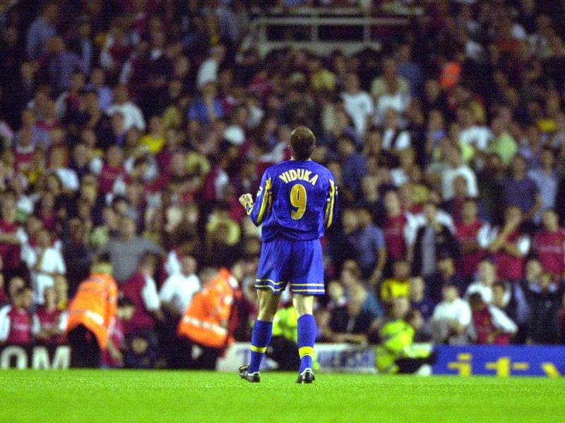 Striker Mark Viduka celebrates at full-time.