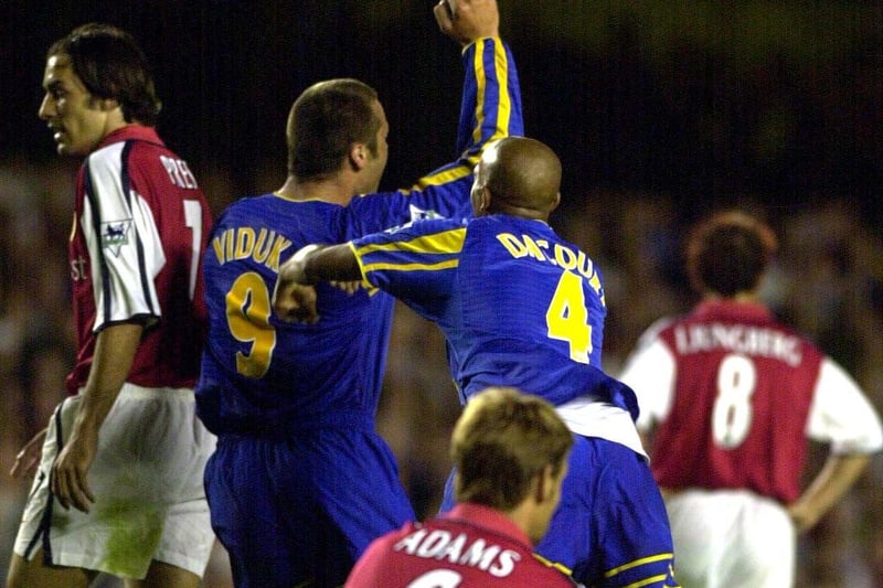 Mark Viduka celebrates with teammate Olivier Dacourt after scoring what proved to be the winning goal at Highbury.