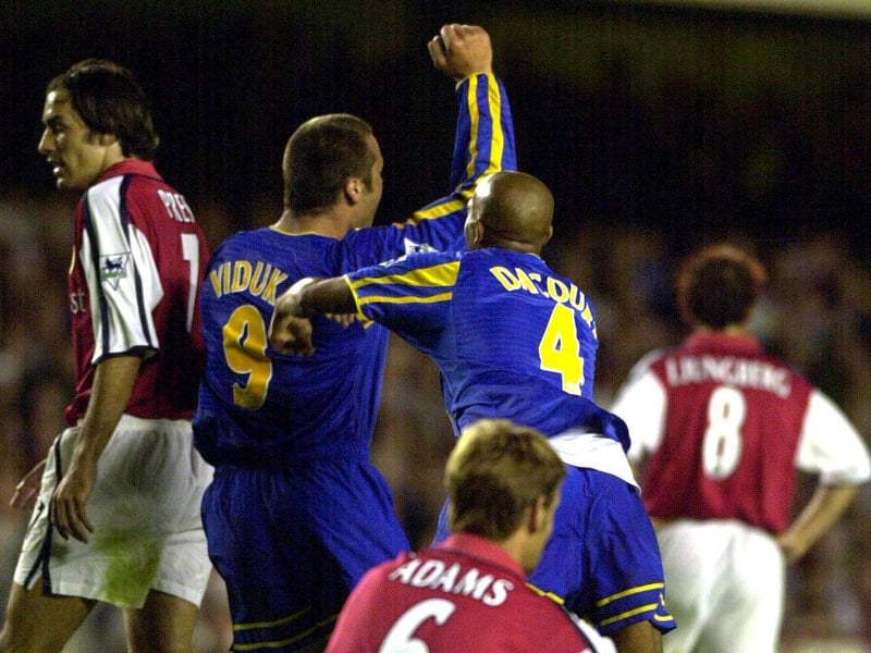 Mark Viduka celebrates with teammate Olivier Dacourt after scoring what proved to be the winning goal at Highbury.