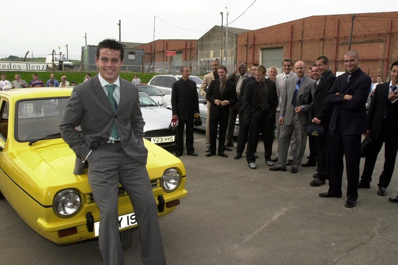 Ian Harte is pictured with a yellow Robin Reliant at Elland Road after being voted the week's worst player in training by his teammates.