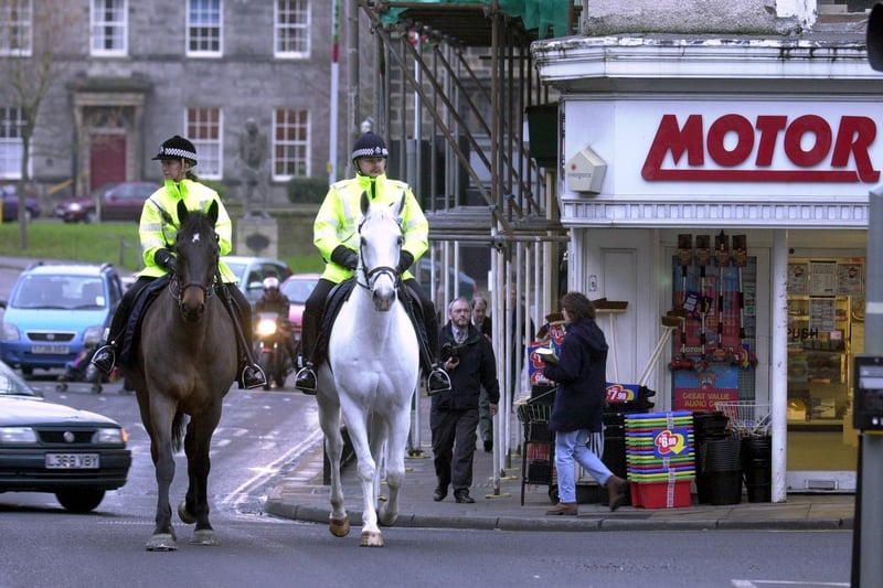 PC Jane Warners (left) with Darrington and PC Mark Waite with Cannon, patroling the streets of Otley in November 2001.