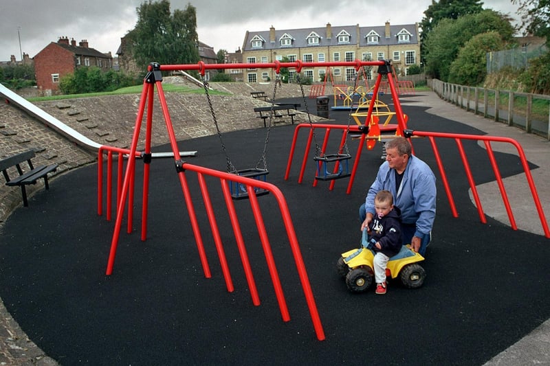 Raymond Hay with grandson Aaron Richardson in the newly-refurbished play area area at Tealbeck Approach in September 2001.