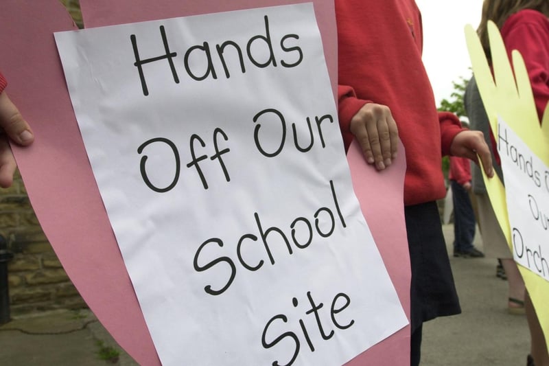 Pupils protest outside closure-threatened Otley All Saints Junior School by forming a human chain around their building in May 2001.