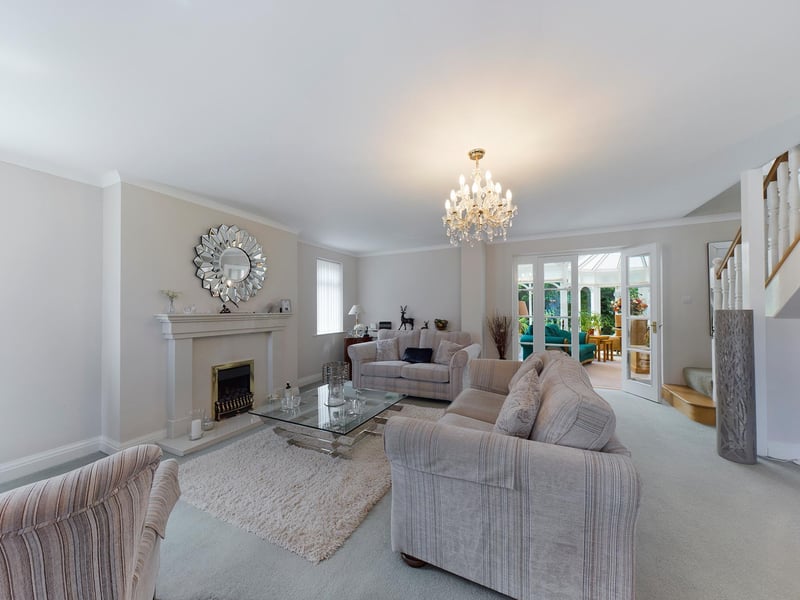 The conservatory is accessed through double doors from the lounge.