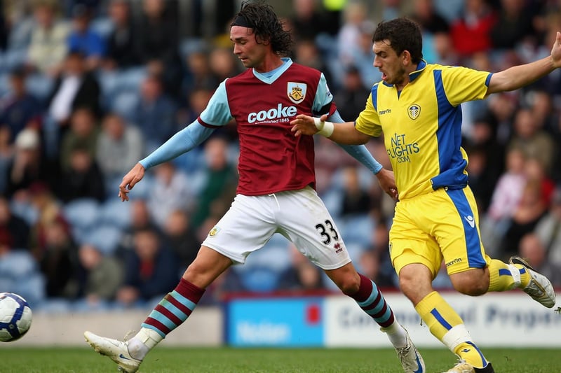 Robert Snodgrass is kept at bay by Burnley's Chris Eagles during a pre-season friendly at Turf Moor in August 2009.