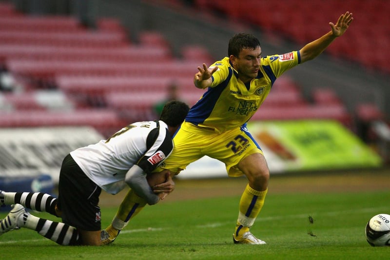 Robert Snodgrass is held back by Darlington's Jeff Smith during the Carling Cup first round clash at the Northern Echo Darlington Arena in August 2009.