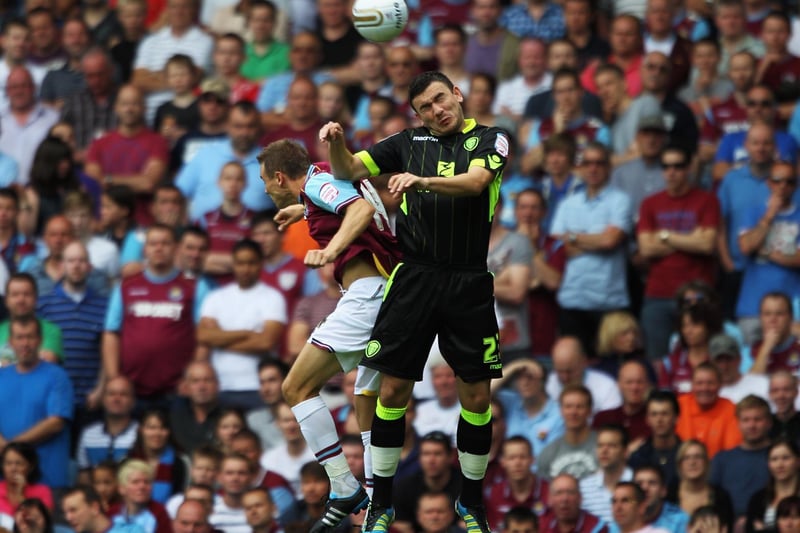 All rise! Robert Snodgrass and West Ham United's Matthew Taylor in an aerial dual during the Championship clash at Upton Park in August 2011.