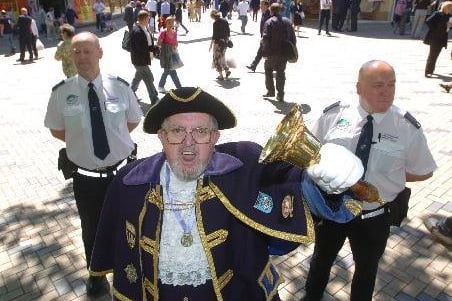 Wakefield town cryer Matthew Hannah launches dropping litter fines in Wakefield city centre, flanked by neighbourhood patrol officers Rob Newton, left and Paul Holland.