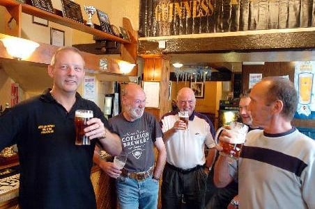 Landlord Neil Weaver, left, drinking with some of his regulars at the Robin Hood pub at Pontefract, where the Pontefract Beer Festival is being held this weekend