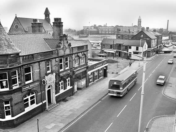 A view of Wallgate, Wigan, from the railway bridge with the Wheatsheaf pub prominent and St Joseph's RC Church and Trencherfield Mill in the background in October 1979