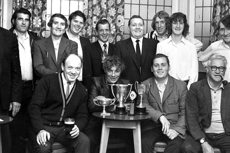 Regulars at the Anderton Arms line up at their annual presentation evening in 1973