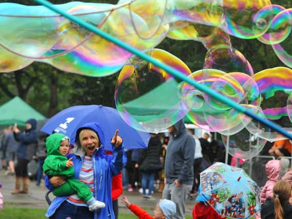 Big bubbles entertain the crowds.