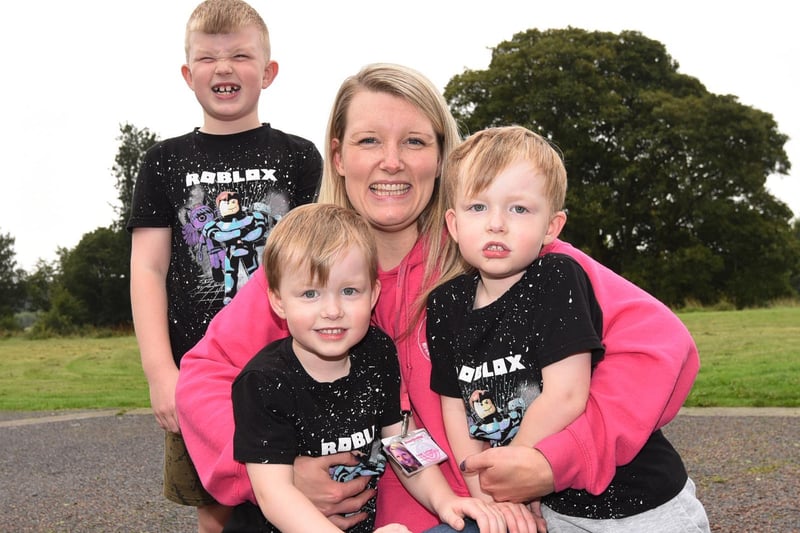 Sarah Collinge with sons Oliver, seven, and twins Toby, left, and Henry, right, four.