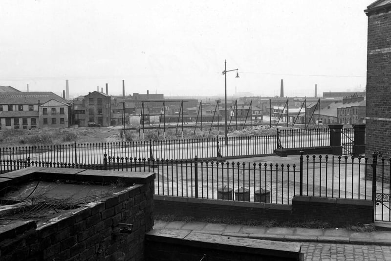 June 1952 and pictured is Hanover Street from Hanover Terrace. A school yard - probably Park Lane Council School - is surrounded by railings.