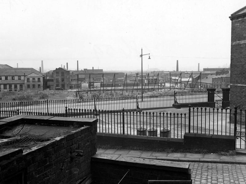 June 1952 and pictured is Hanover Street from Hanover Terrace. A school yard - probably Park Lane Council School - is surrounded by railings.