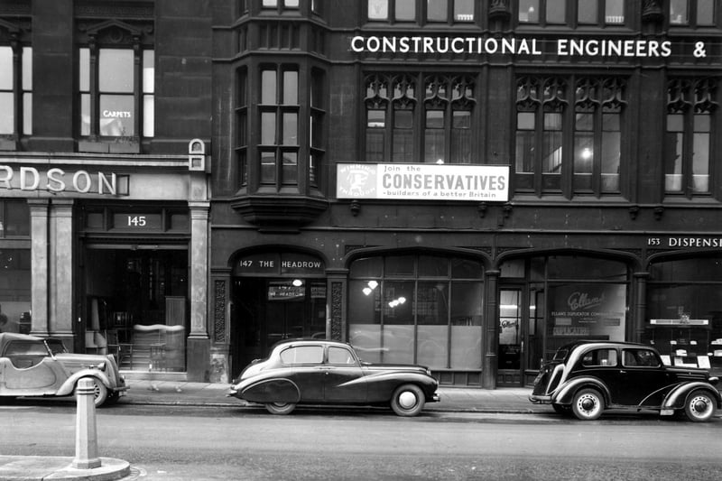 The Headrow in November 1952 showing W. Richardson Ltd. furnisher, City of Leeds Conservative Association, Dunlop and Ranken constructional engineers, Ellans Duplicator Co. Ltd.