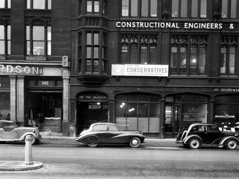 The Headrow in November 1952 showing W. Richardson Ltd. furnisher, City of Leeds Conservative Association, Dunlop and Ranken constructional engineers, Ellans Duplicator Co. Ltd.