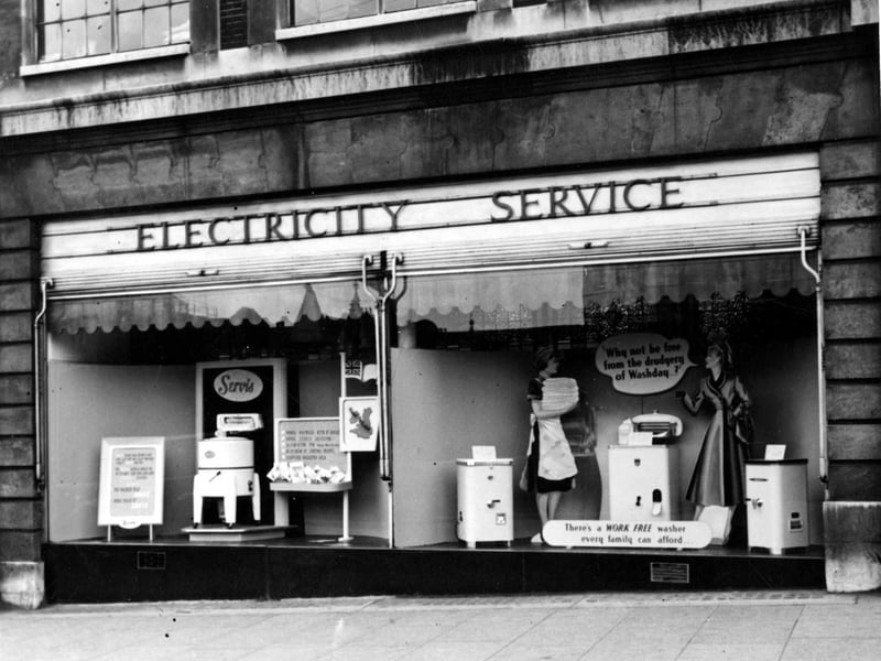 Electricity Showrooms on The Headrow which has two large window displaying the latest models of washing machines manufactured by Servis. Pictured in September 1952.